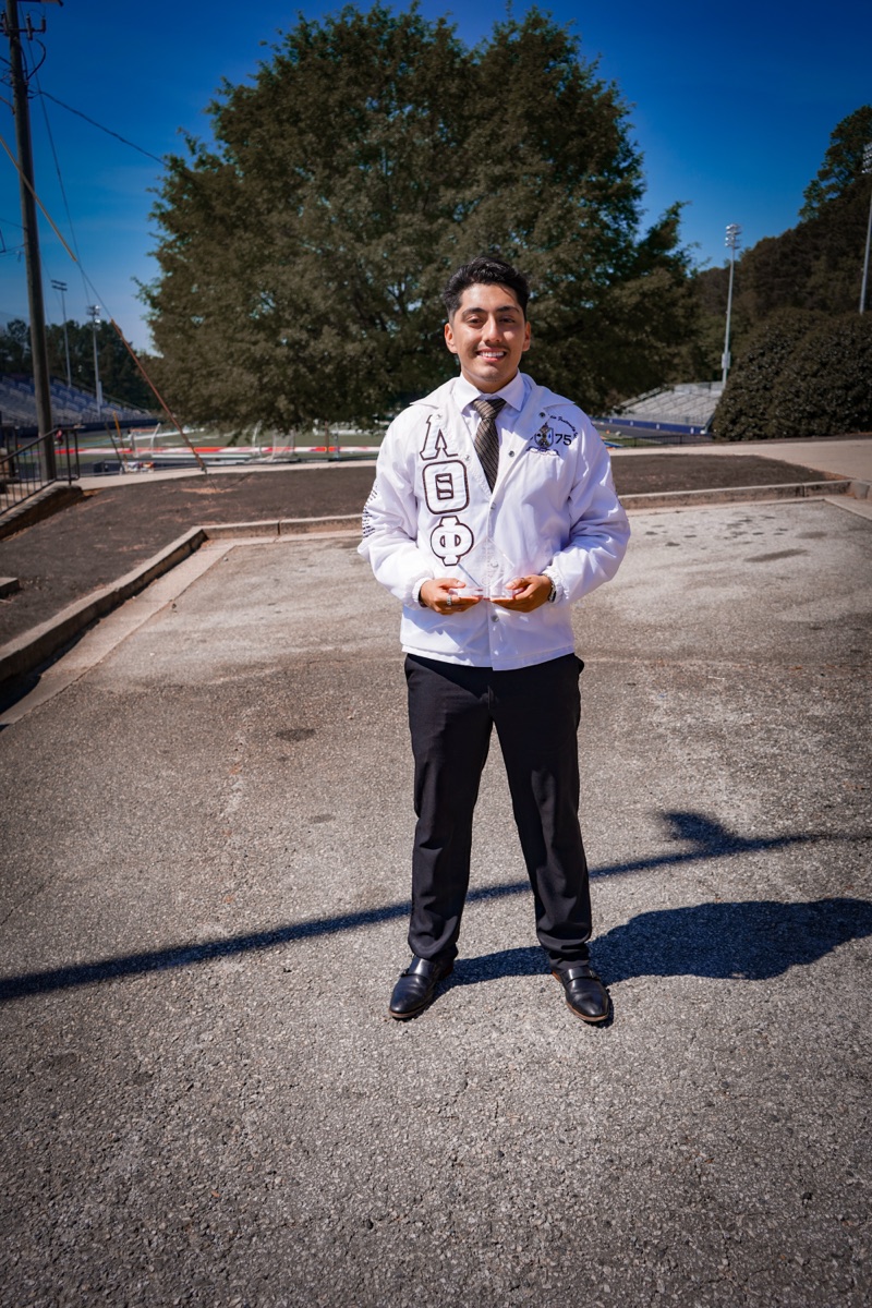 Lambda Theta Phi — white jacket portrait